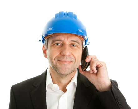 Portrait of architect wearing blue hard hat and talking on mobile phone. Isolated on white
