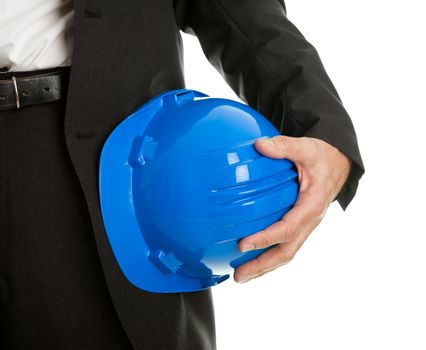 Close-up of architect/worker holding blue hard hat. Isolated on white