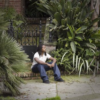 African American Teen Boy Sitting on Step