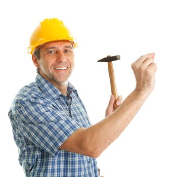 Confident worker wearing hard hat and hammering in. Isolated on white