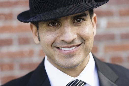 Portrait of Smiling Man Wearing a Black Suit and Tie