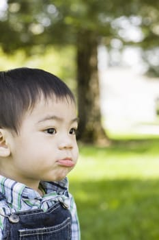 Young Boy in Park Making a funny Face