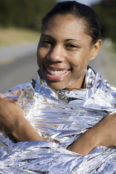 Portrait of a Runner in Space Blanket Smiling to camera