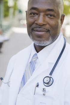 Portrait of Doctor with Stethoscope Smiling To Camera