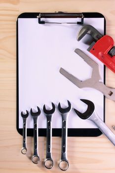 Set of wrenches on Blank Clipboard for the business connected with repair work.