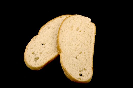 Sample a piece of sliced bread on a black background.
