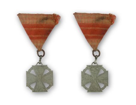 ancient medal with red ribbon from 1916