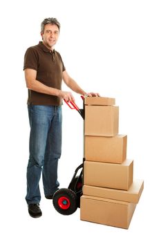 Delivery man with hand truck and stack of boxes. Isolated on white