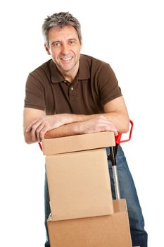 Delivery man with hand truck and stack of boxes. Isolated on white