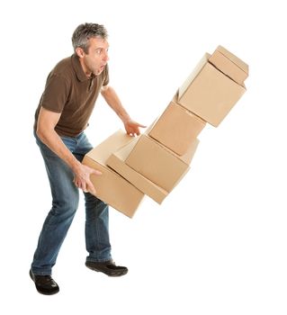 Delivery man with falling stack of boxes. Isolated on white