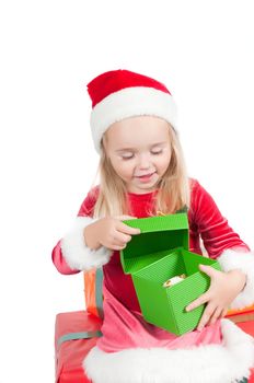 Christmas toddler with present boxes, studio shot