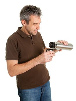 Portrait of senior man drinking coffee/tea from thermos. Isolated on white