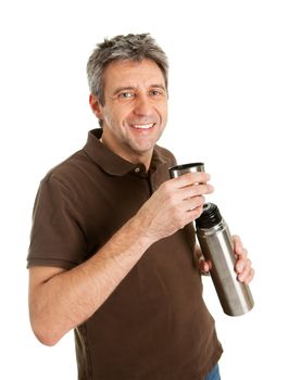 Portrait of senior man drinking coffee/tea from thermos. Isolated on white