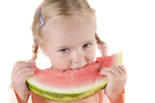 Shot of little girl eating watermelon isolated on white