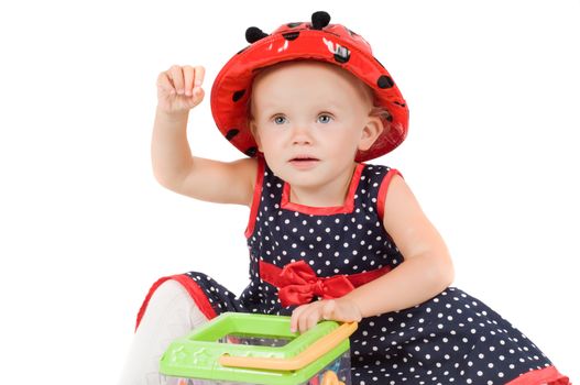 Shot of little girl in polka dot dress in studio