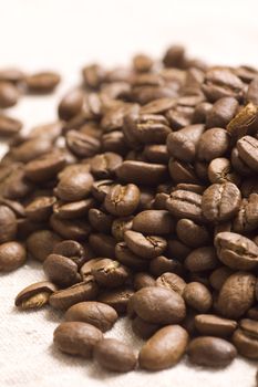 Roasted coffee beans on jute sacking
