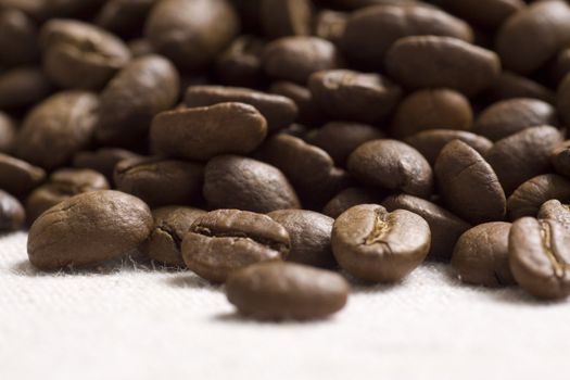 Roasted coffee beans on jute sacking
