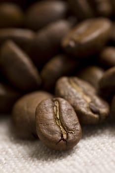 Roasted coffee beans on jute sacking