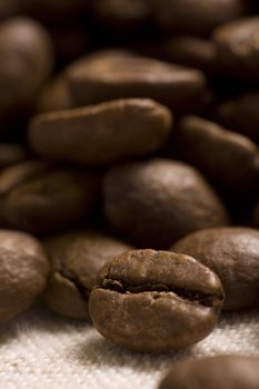 Roasted coffee beans on jute sacking