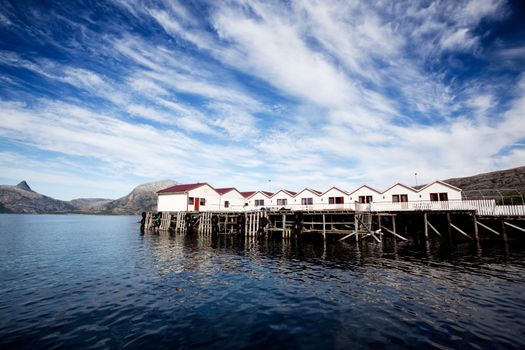 A group of cabins on the ocean