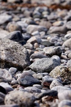 A coastal rock background with round water washed rocks