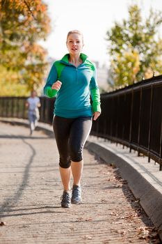 A woman jogging in a park