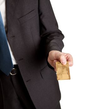 Close-up of businessman holding credit card. Isolated on white