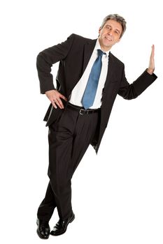 Portrait of business man leaning on wall. Isolated on white