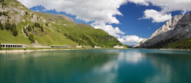 The artificial lake and pass of Fedaia (Dolomites, Trentino, Italy), at summer