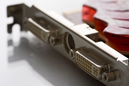 Close up a video card on a white background with shallow depth of field. DVI connectors visible.