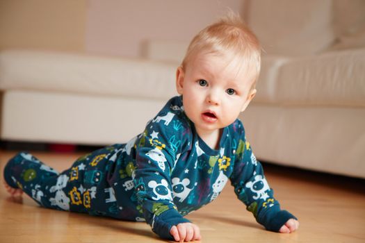 baby crawling on a floor