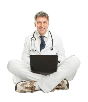Medical doctor sitting and working on laptop. Isolated on white