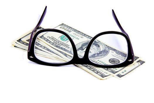 eyeglasses on hundred dollar notes