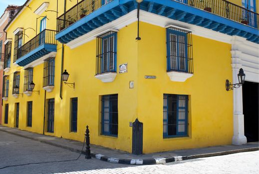 Yellow house in a corner in old havana in Cuba