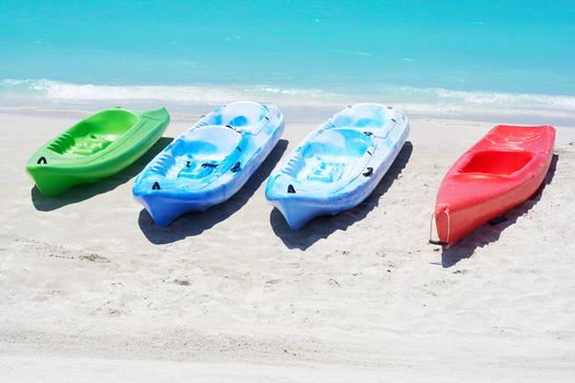 Group of kayaks ready to be rented in a beach