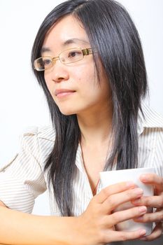 Chinese businesswoman drinking coffee