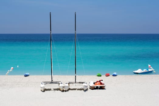 Katamarans and water bicycles in a beach