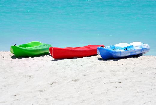 Group of kayaks ready to be rented in a beach