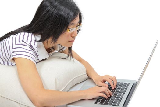 Young chinese woman sitting on the floor with laptop