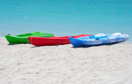 Group of kayaks ready to be rented in a beach