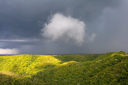 View of a green tropical valley with clouds in the sky