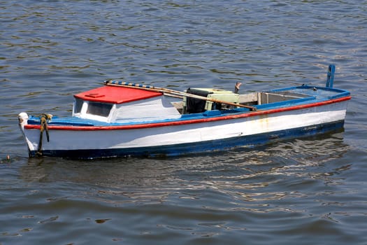 Old fishing boats with reflections in the sea