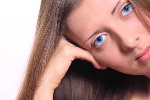 Portrait of the blue-eyed girl removed close up