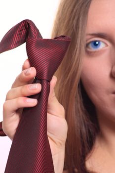 The girl with a red striped tie removed close up