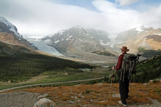 Hiker Looking Out Over Glaciers of the Columbia Icefield in the Rocky Mountains - Jasper National Park, Alberta