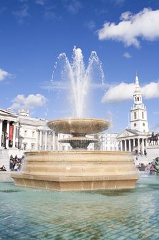 Fountain in Trafalgar Square with the National Gallery and St Martin church in the background