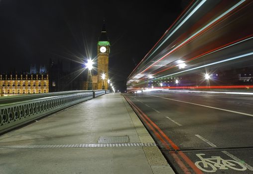 The Big Ben and Westminster Bridge at night with traffic light trails