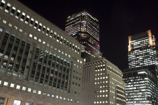 View of Canary Wharf skyscrapers in London at night 