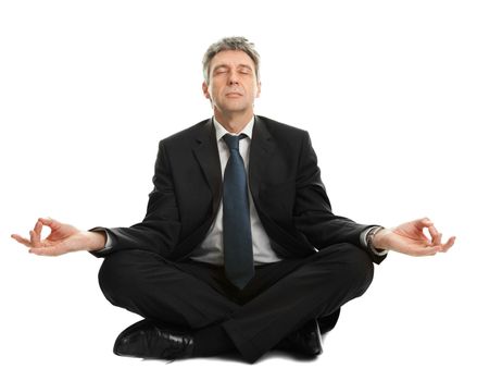 Businessman sitting in lotus flower position of yoga. Isolated on white