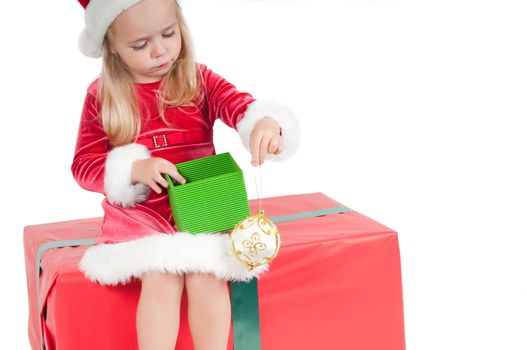 Christmas toddler with present boxes, studio shot